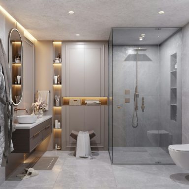 Modern bathroom featuring a glass shower, vanity, and elegant lighting.